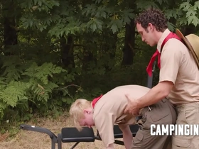 Camp trainer motivates twink to workout