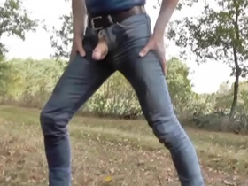 Pissing in jeans and rubber